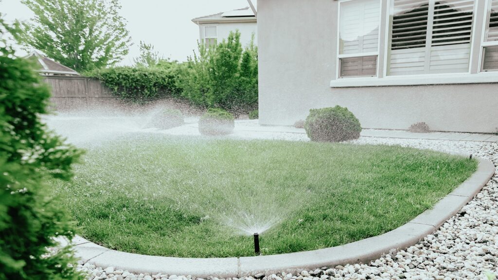 Sprinkler System watering backyard green space