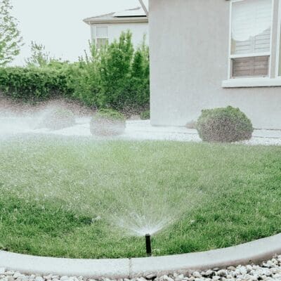 Sprinkler System watering backyard green space