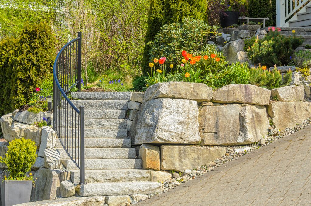 Custom retaining wall and walkway in front of a home