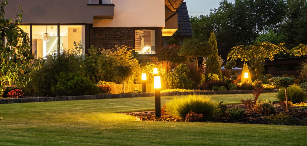 Modern-home-with-exterior-lighting-and-custom-landscaping