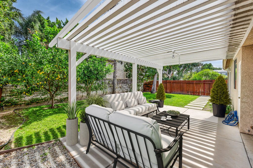 Vinyl-Pergola-over-patio-in-a-backyard