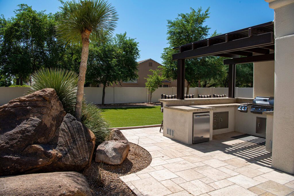 outdoor-kitchen-and-custom-paver-patio-with-custom-landscaping