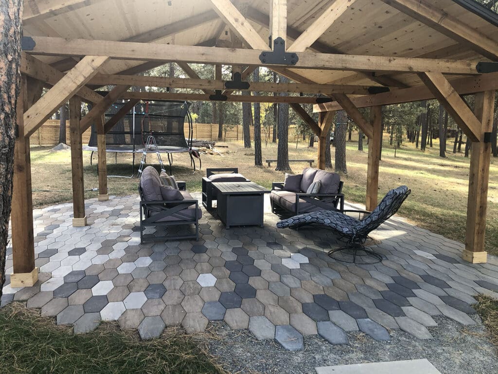 Custom pavers and awning for outdoor living space in the black hills